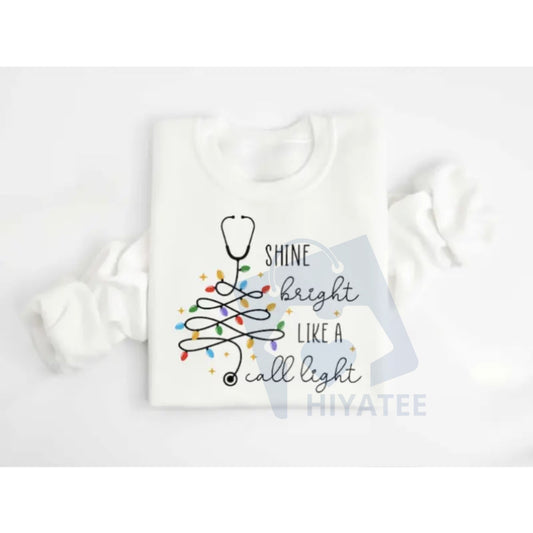 Shine Bright Like A Call Light Sweatshirt: Stethoscope Christmas Tree Long Sleeve, Nurse Christmas Hoodie, Therapist Hospital Xmas Tee - Hiyatee